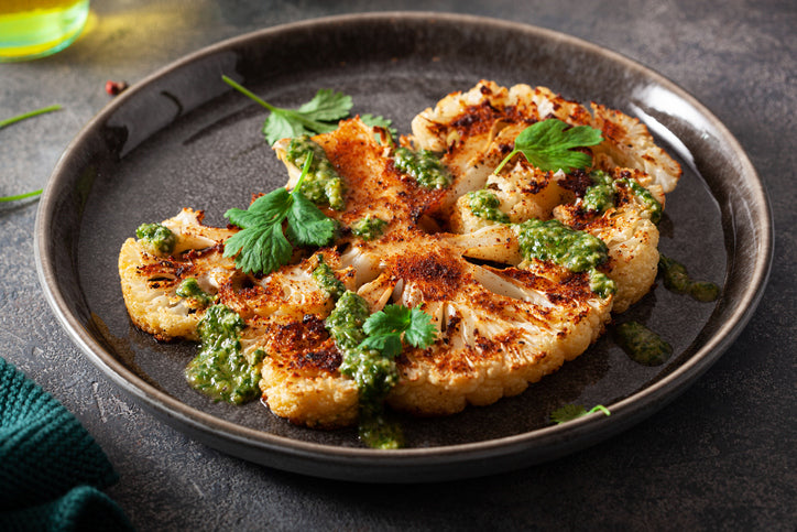 Spiced Cauliflower Steaks with Herb-infused Pesto Sauce
