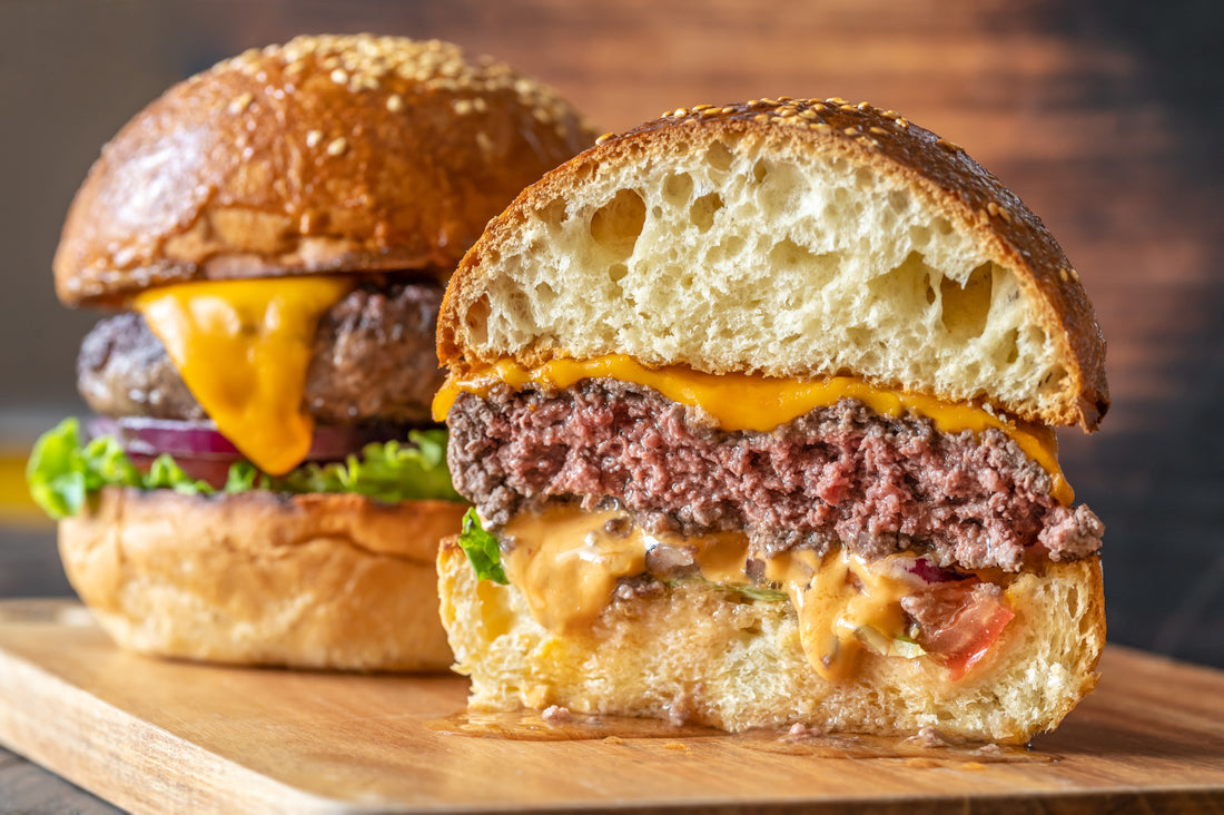Juicy cheese burger cut in half