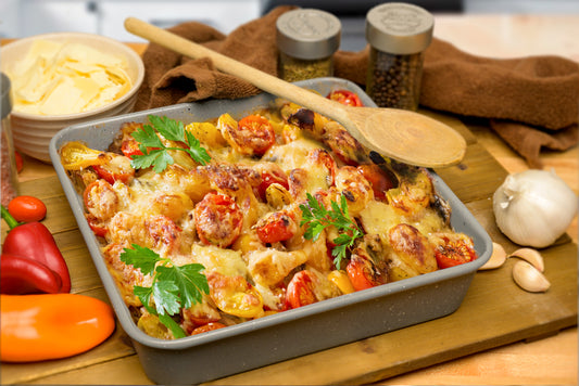 Baked vegetables with cheese in square casserole pan